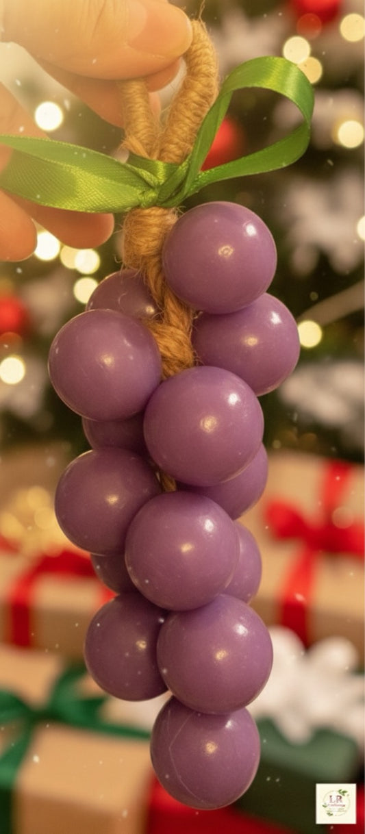 Purple grape cluster soap with green ribbon.”